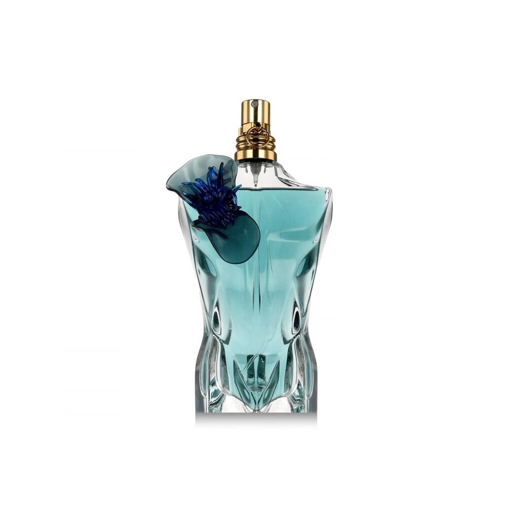 Türkisgrüner Flakon in Torsoform mit blauem Blütenaufsatz. Goldfarbener Sprühkopf.