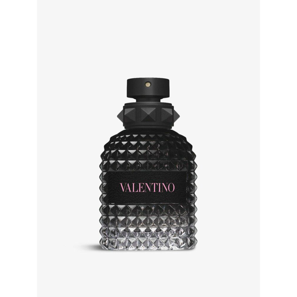 Schwarzer Flakon mit rosafarbenem Schriftzug VALENTINO. Geometrisches Muster. Schwarzer Verschluss.