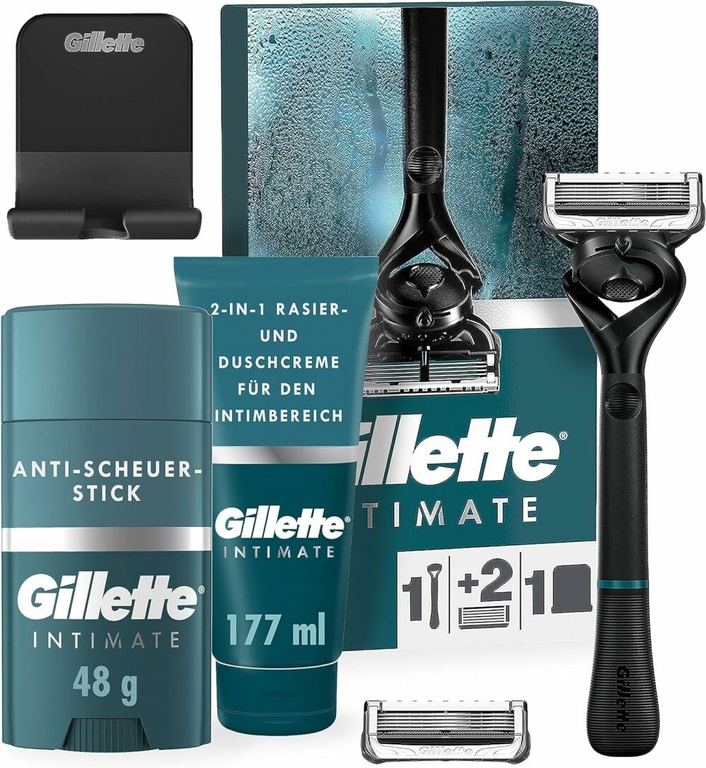 Gillette Intimate Rasierset für Männer. Enthält Rasierer, Klingen, Rasiercreme, Anti-Scheuer-Stick und Halterung. Verpackung mit Produktabbildung.