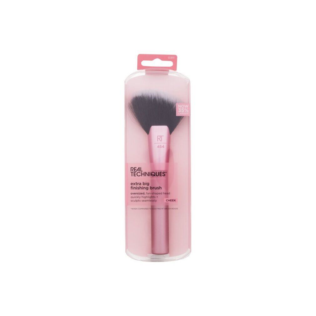 Pinsel in rosa Verpackung. Schwarzer Pinselkopf, rosa Griff. Text: Real Techniques, extra big finishing brush.