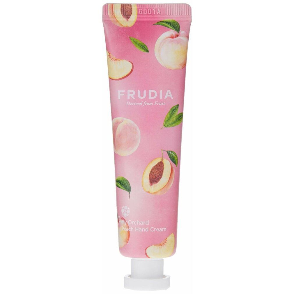Rosa Tube mit Pfirsich-Motiv und Aufschrift FRUDIA. Produktname: My Orchard Peach Hand Cream. Weißer Verschluss.