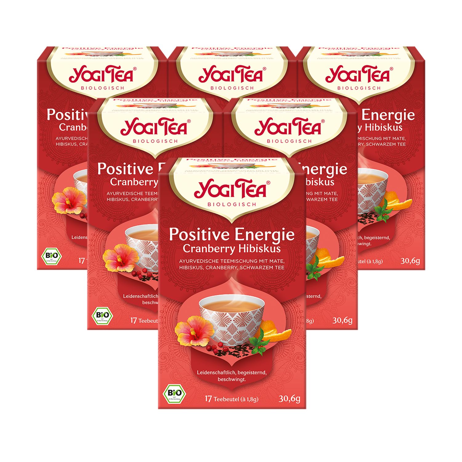 Mehrere Packungen Yogi Tea Positive Energie Bio Schwarztee. Rote Verpackung mit Produktbild und Text. Bio-Siegel.