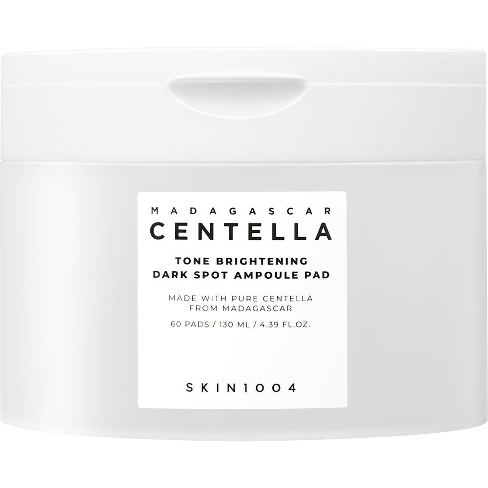Weiße Dose mit SKIN1004 Madagascar Centella Tone Brightening Dark Spot Ampoule Pad Aufschrift.