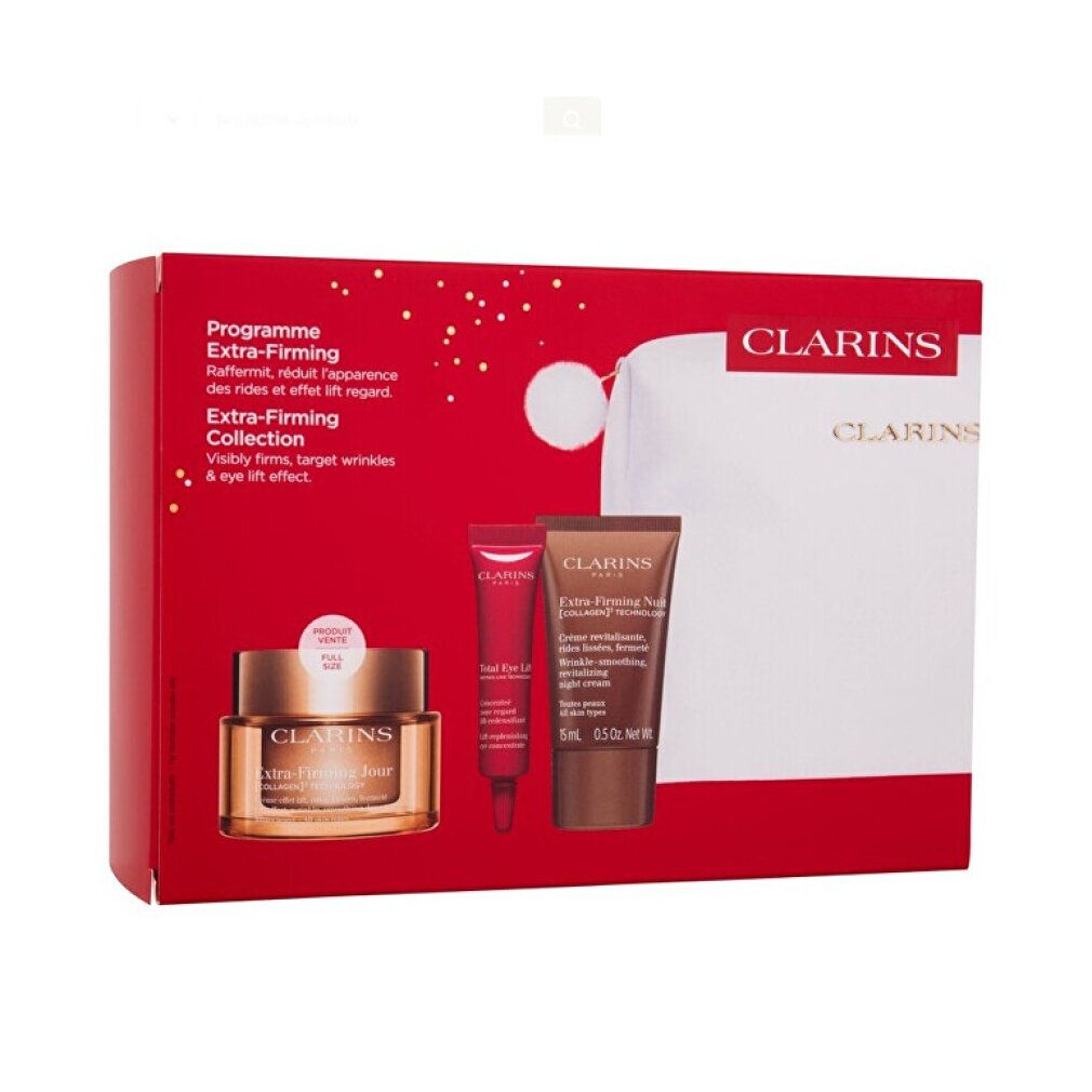 Geschenkbox mit Kosmetikprodukten. Rote Box mit Creme, Augencreme, Tube und Tasche. Goldfarbene Creme-Dose.