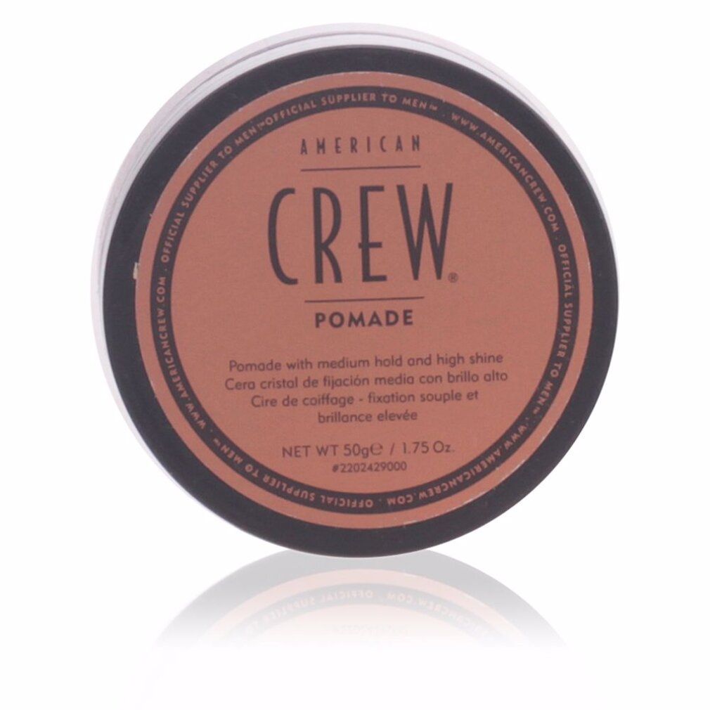 Runde, schwarze Dose mit braunem Deckel. Aufschrift: AMERICAN CREW. Pomade. Netto 50g/1.75 Oz. Reflektion.