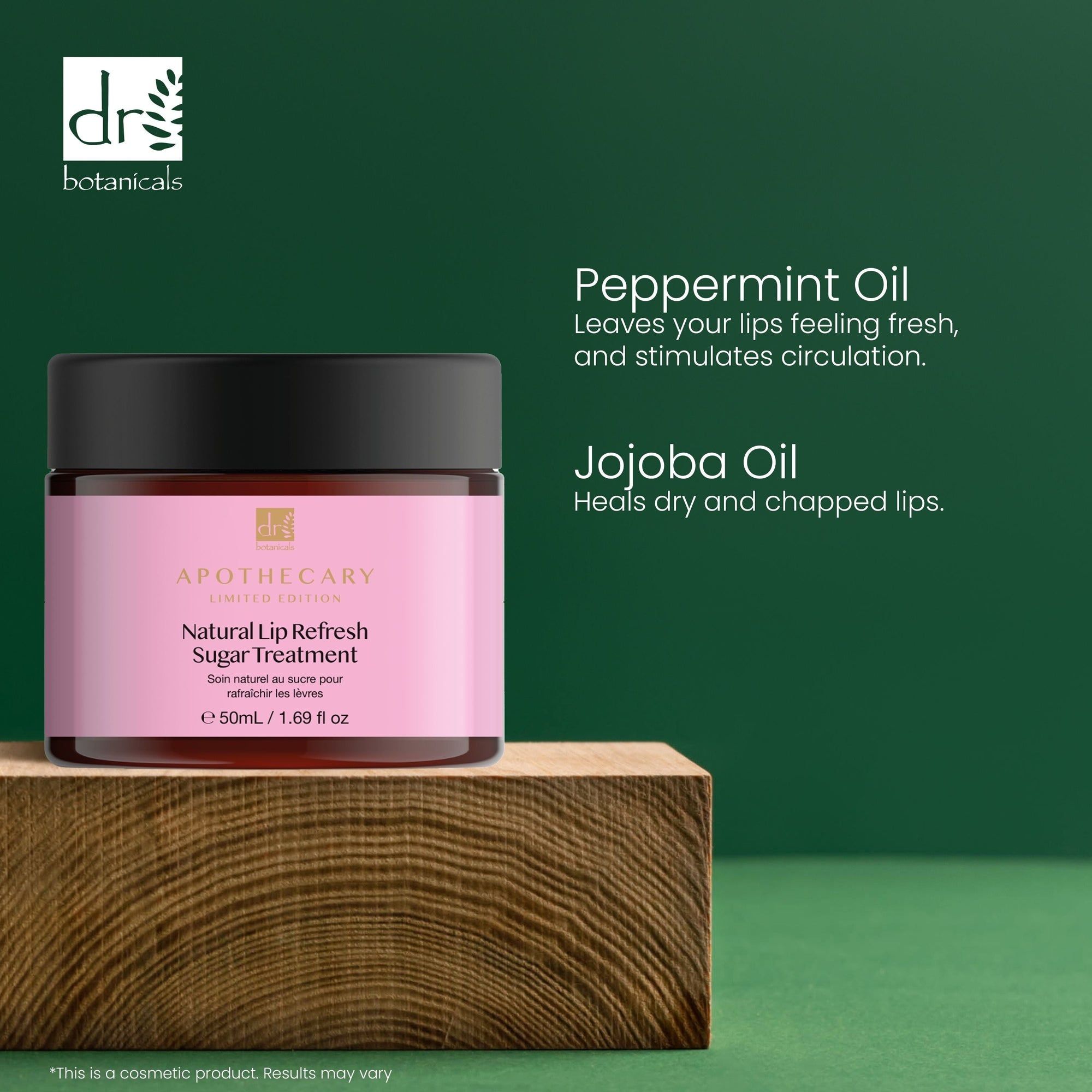 Rosa Glas mit schwarzem Deckel auf Holzblock. Aufschrift: Natural Lip Refresh Sugar Treatment. Apothecary Limited Edition. Text: Peppermint Oil, Jojoba Oil.