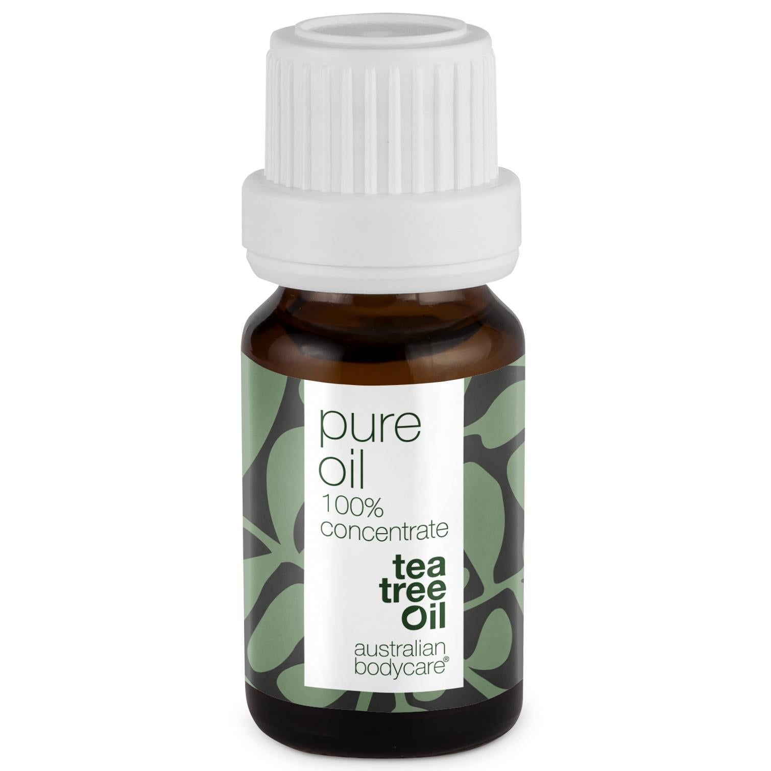 Braune Glasflasche mit weißem Deckel. Etikett mit Text: pure oil, 100% concentrate, tea tree oil, australian bodycare.
