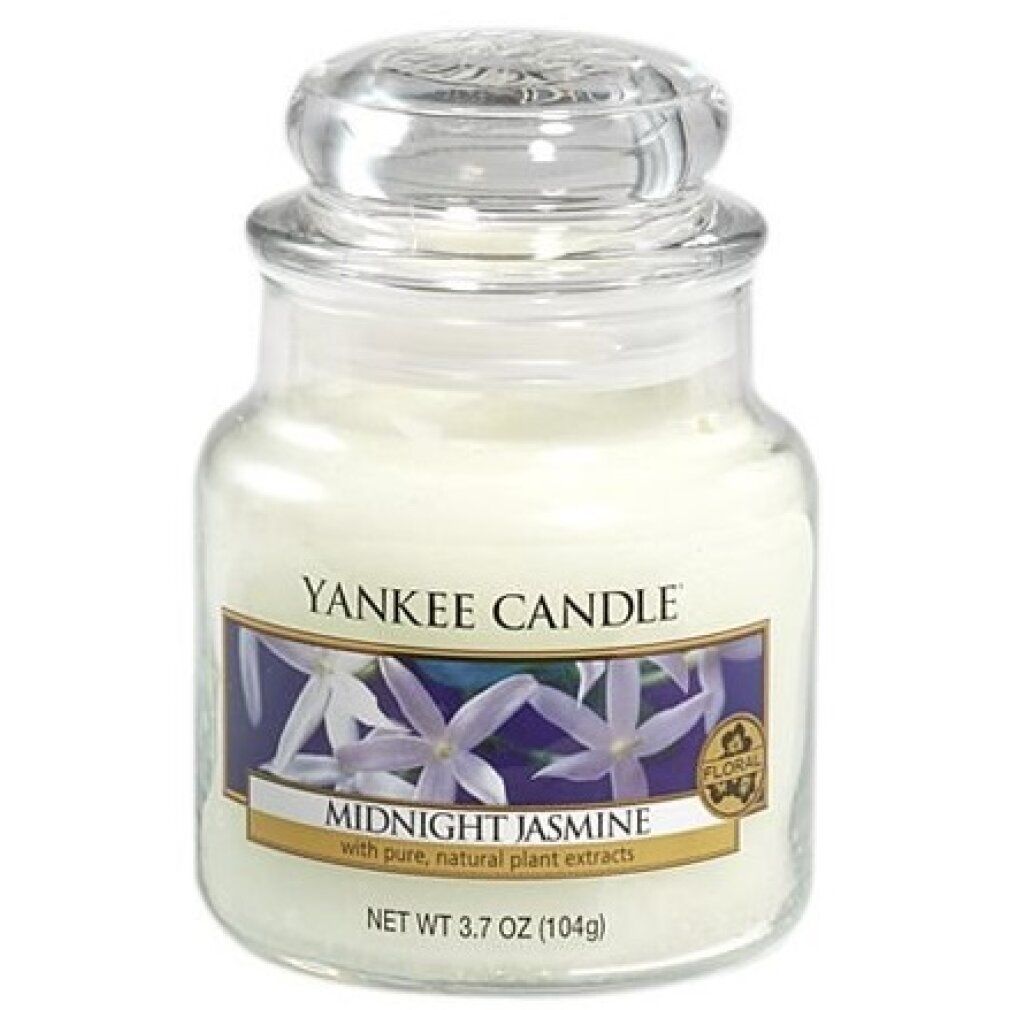 Duftkerze im Glas mit Deckel. Aufkleber mit Blumenmotiv und Schriftzug "Midnight Jasmine". Marke: Yankee Candle. Siegel: Floral.