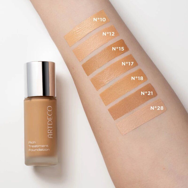 Flasche mit hellem Foundation-Make-up und Swirl.