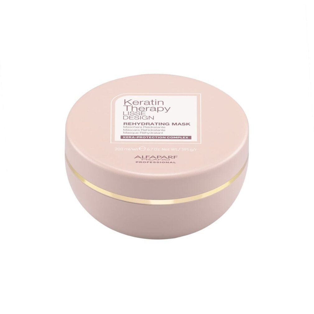 Rosa Dose mit goldfarbenem Band, enthält Keratin Therapy Lisse Design Rehydrating Mask.