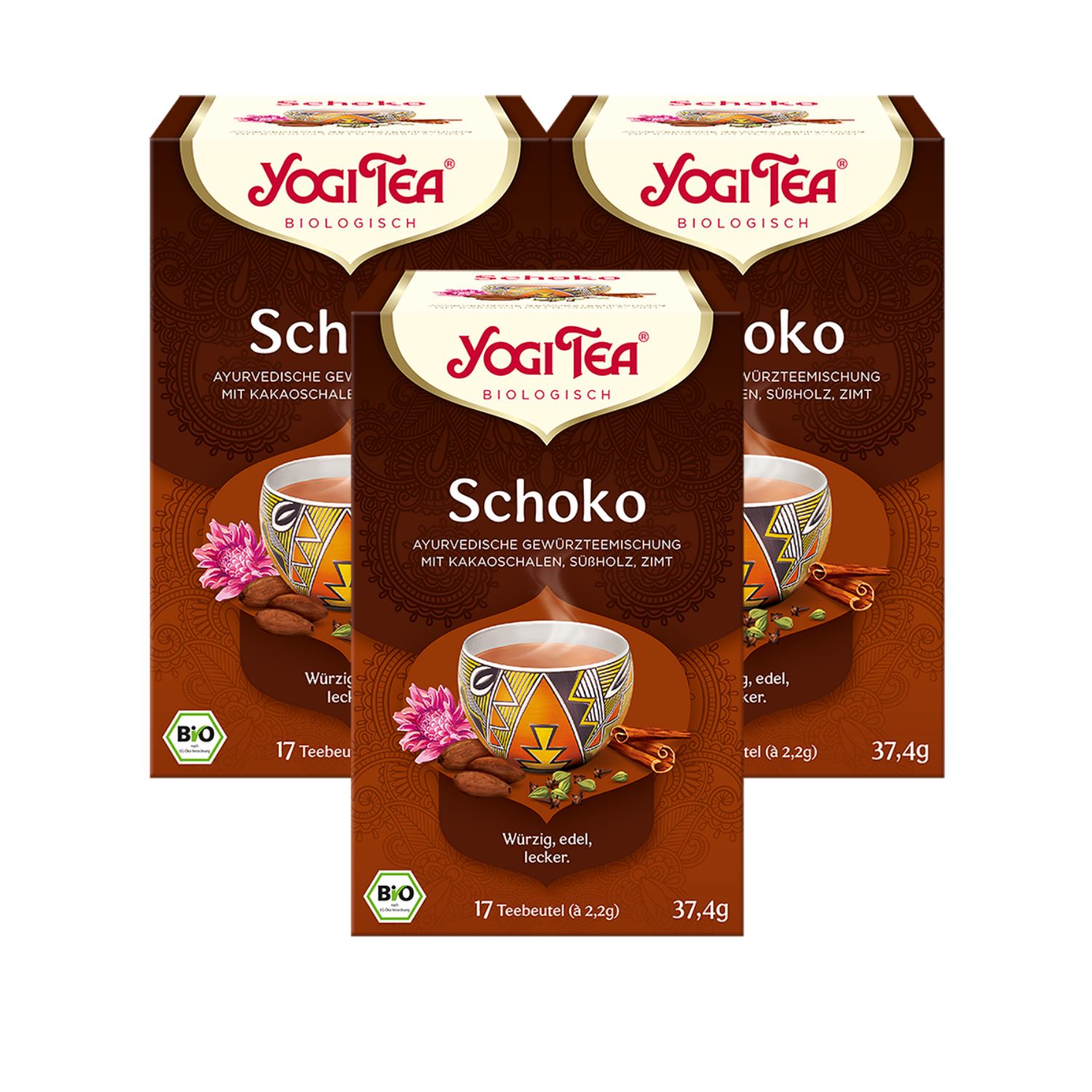 Drei Schachteln Yogi Tea Schoko. Braune Verpackung mit Logo, Produktname und Zutaten. Bio-Siegel.