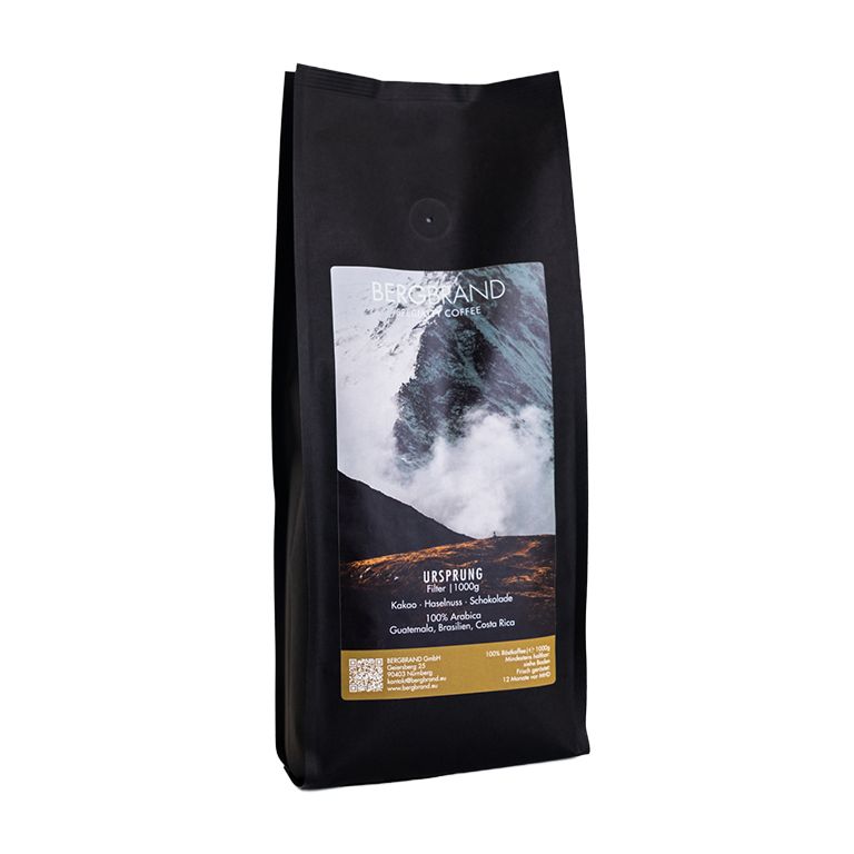 Schwarze Kaffeepackung. Text: BERGBRAND, Ursprung, Filter, 250g. Zutaten: Kakao, Haselnuss, Schokolade, 100% Arabica.