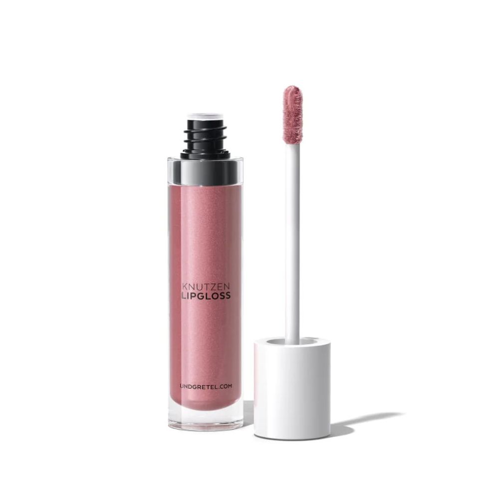 Lipgloss-Flakon mit Applikator. Rosa Farbton. Schriftzug: KNUTZEN LIPGLOSS. Marke: UND GRETEL. Website-Adresse.