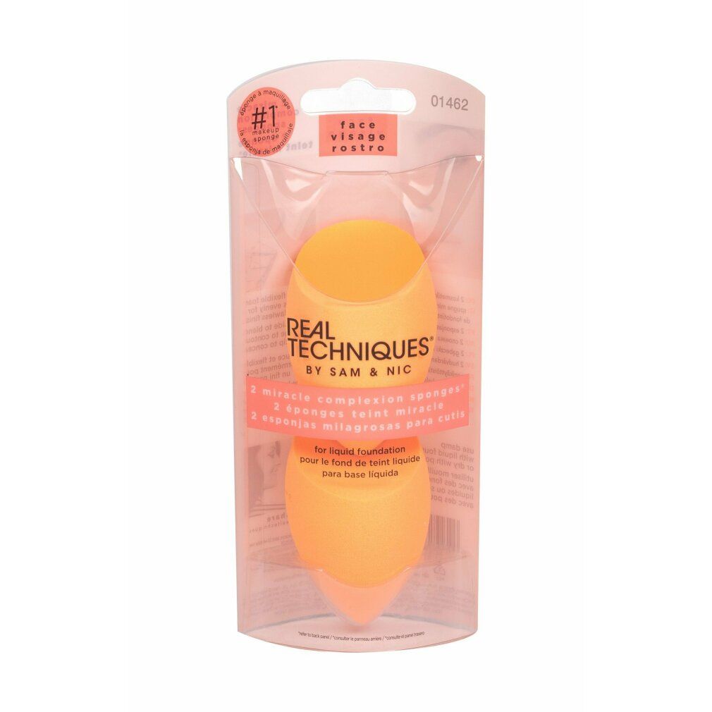 Zwei orangefarbene Schwämme in einer Verpackung. Aufschrift: REAL TECHNIQUES, 2 miracle complexion sponges.