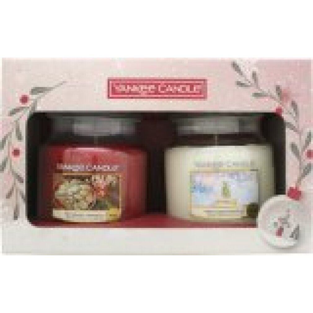 Geschenkbox mit zwei Yankee Candle Gläsern. Rote und weiße Kerzen, Logo oben. Ornament-Dekoration.