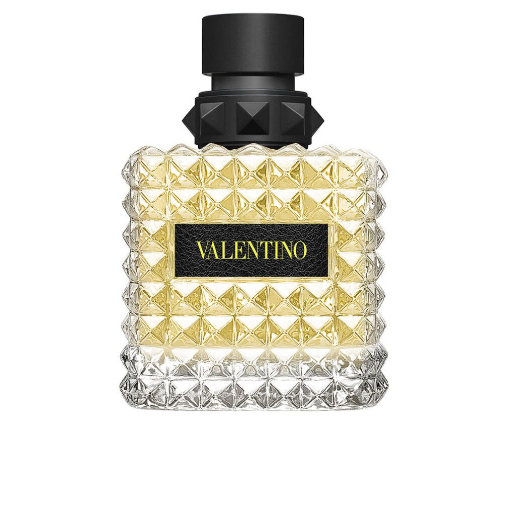 Parfümflakon mit quadratischem Design und pyramidenförmigen Details. Schwarzer Verschluss. VALENTINO-Logo auf schwarzem Etikett.