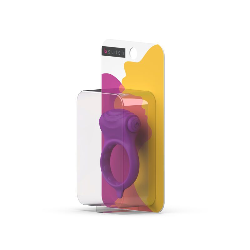 Verpackung mit lila Silikonring. Sichtbar: Ring, transparente Blisterverpackung, gelb-rosa Hintergrund, Markenname.