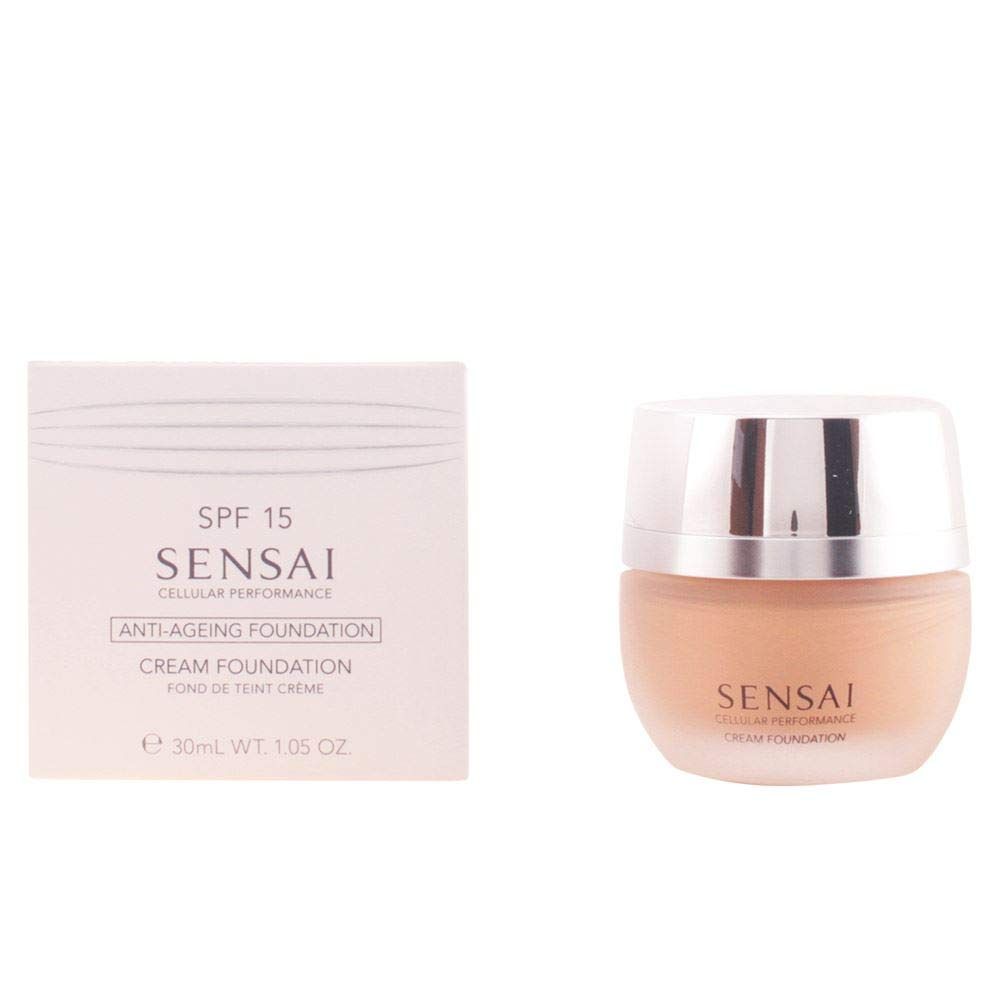 Creme-Foundation und Verpackung. Auf der Verpackung steht SPF 15, Sensai, Anti-Ageing Foundation, Cream Foundation. Das Produkt ist in einem Glasbehälter.