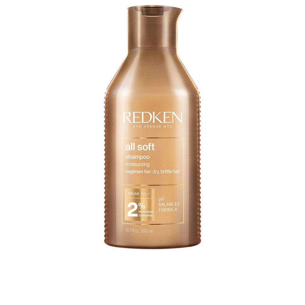 Goldfarbene Shampoo-Flasche mit "Redken" und "all soft". Enthält Arganöl und 2% Feuchtigkeitskomplex. pH-ausgeglichene Formel.
