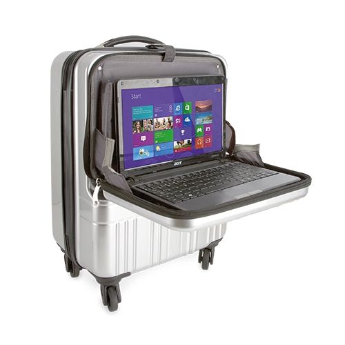 Silberner Trolley mit Laptop. Laptop auf ausklappbarem Fach. Bildschirm mit Windows-Oberfläche.