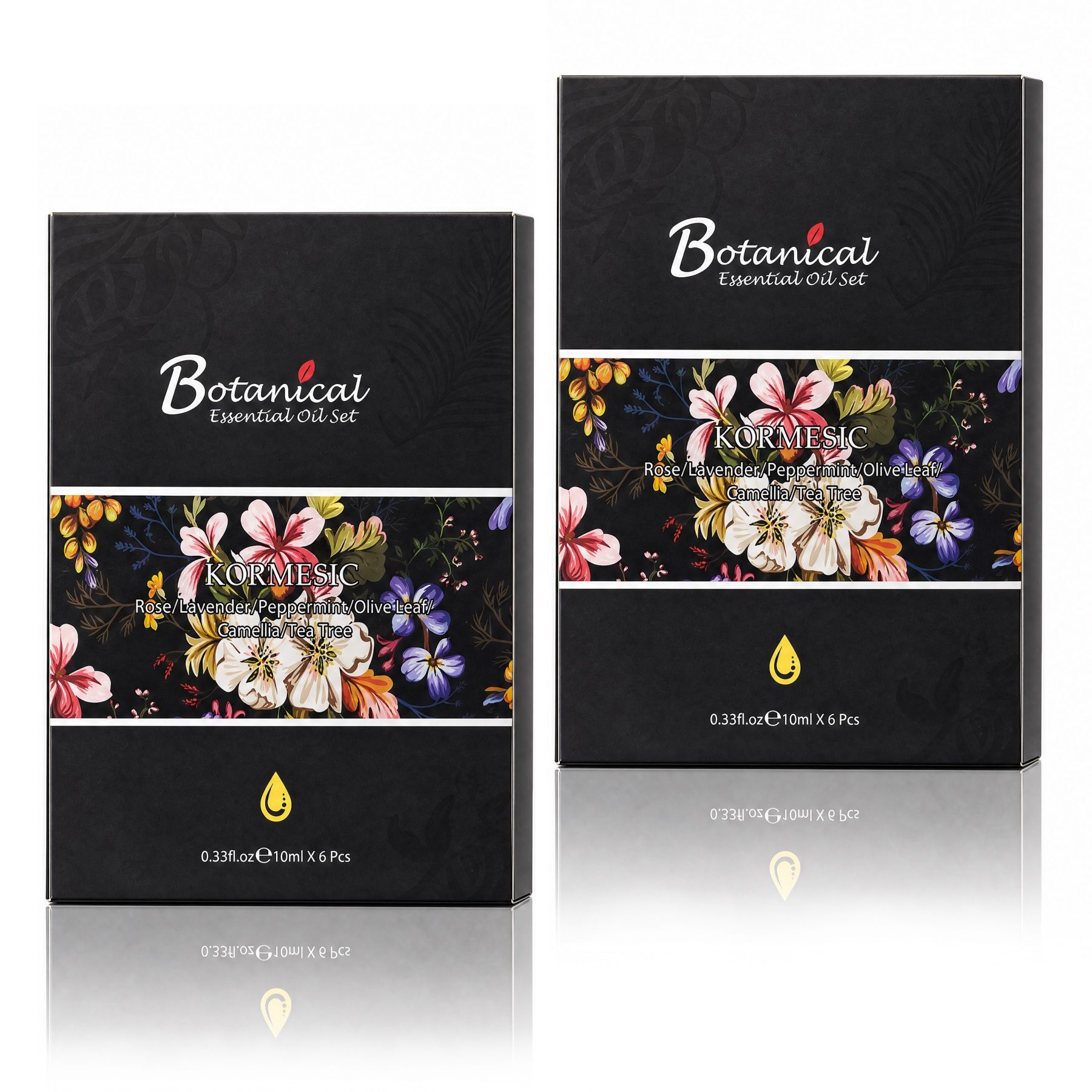 Zwei schwarze Kartons für ätherische Öle mit floralem Design. Enthält "Botanical Essential Oil Set" und "Kormesic".