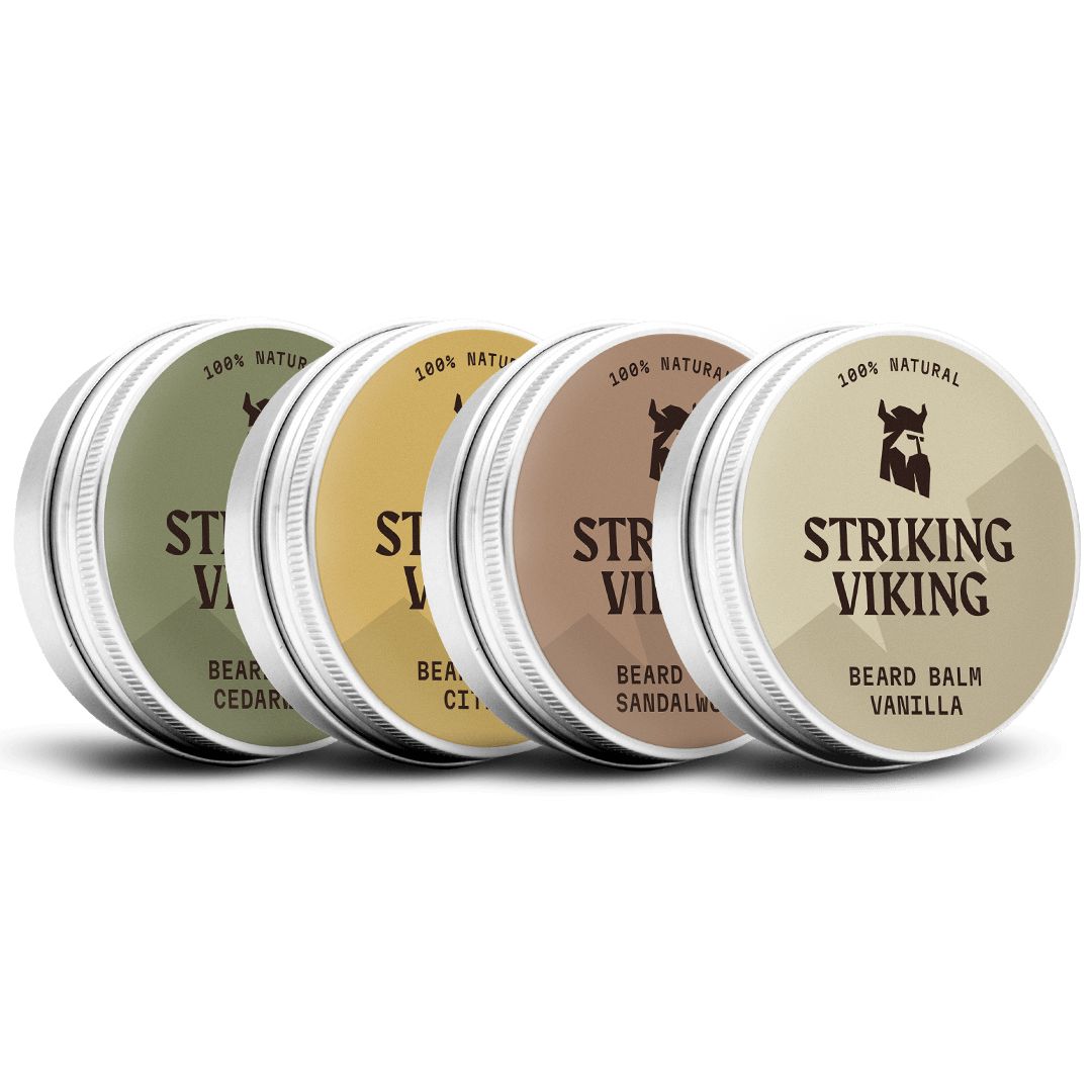 Vier runde Metallbehälter mit Deckel. Aufschrift "Striking Viking" und "Beard Balm". Farben: Grün, Gelb, Braun, Beige. Text: "100% Natural".