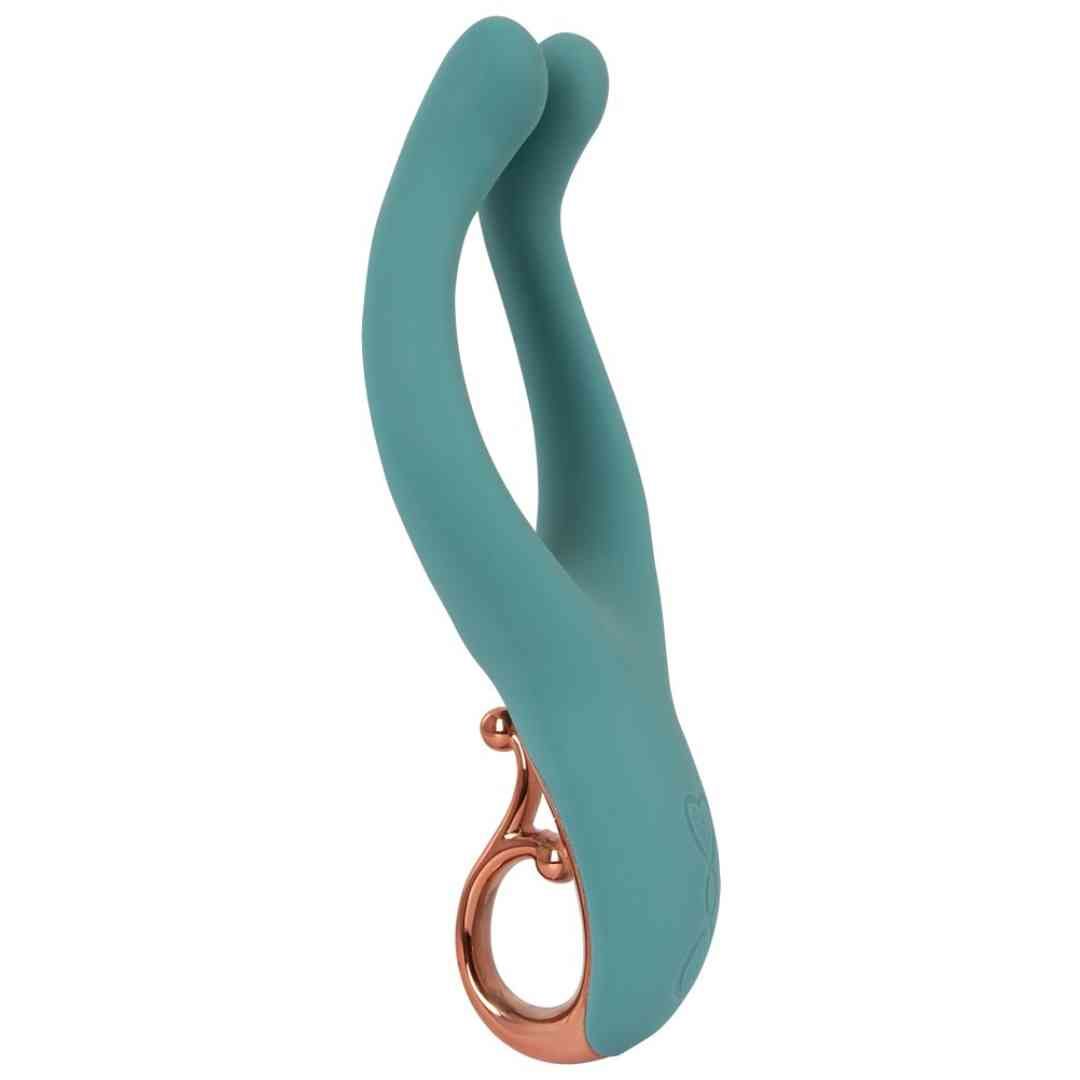 Türkisfarbenes Wellness-Produkt mit zwei gebogenen Enden und einem Ring.