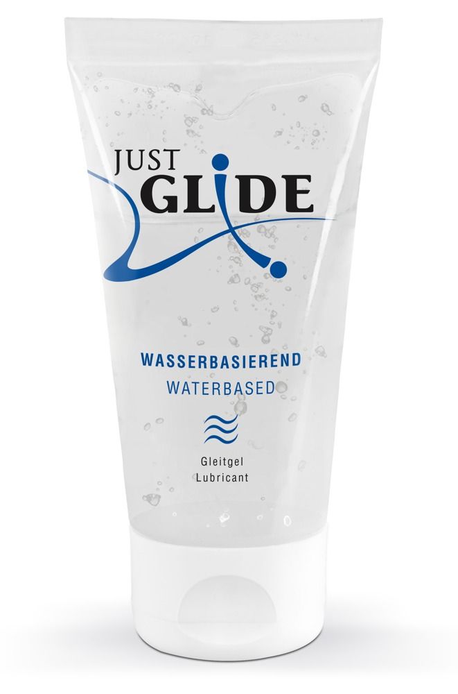 Transparente Tube mit weißem Deckel. Aufschrift: JUST GLIDE, Wasserbasiert, Gleitgel/Lubricant. Blaue Designelemente.