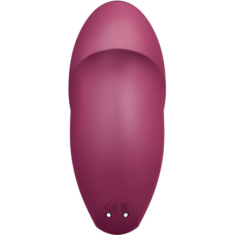 Bordeauxfarbenes Gerät. Unterseite mit zwei Löchern. Form: oval.