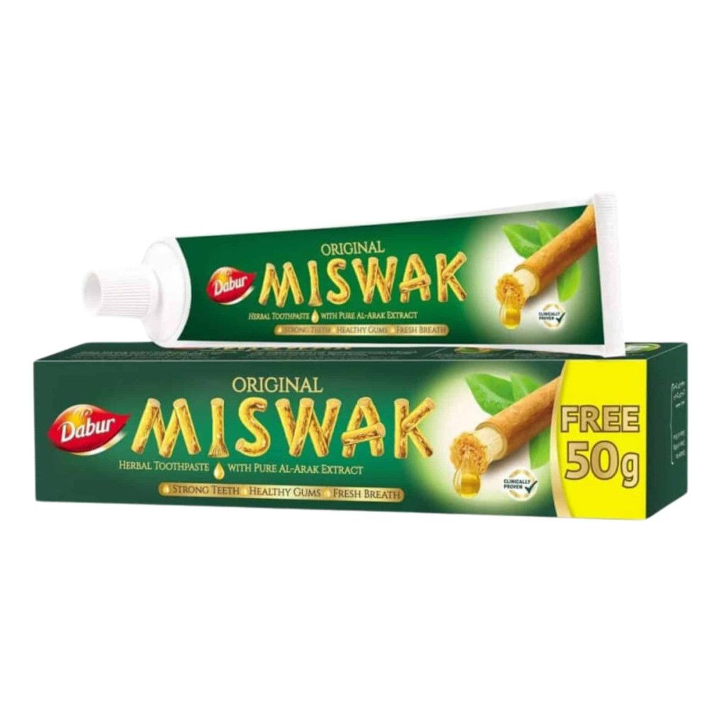 Zahnpasta-Tube und -Schachtel. Aufschrift: Original Miswak. Grün-goldene Verpackung. Enthält Al-Arak-Extrakt. Kostenlos 50g.