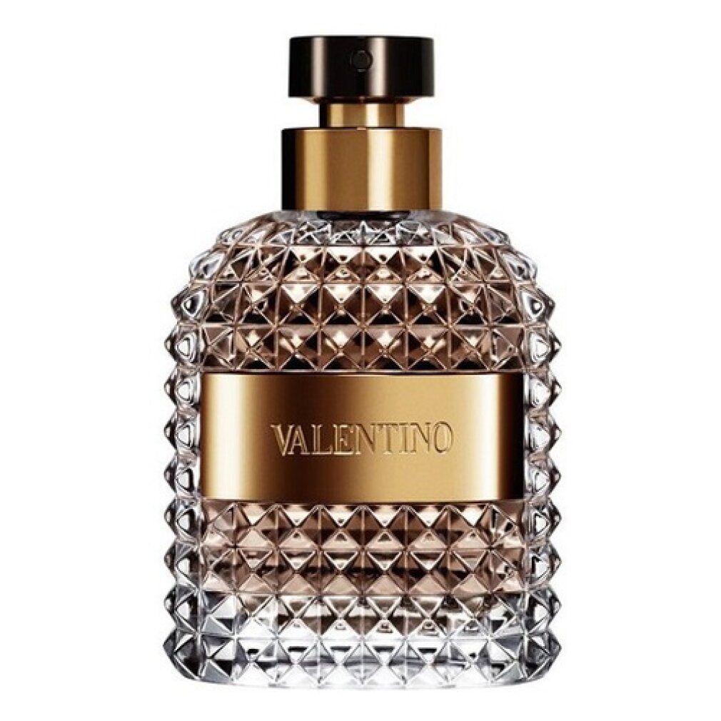 Valentino Uomo Edt Spray Flakon. Pyramidenförmiges Design, goldfarbene Band und schwarzer Deckel. Klarer Glasflakon.