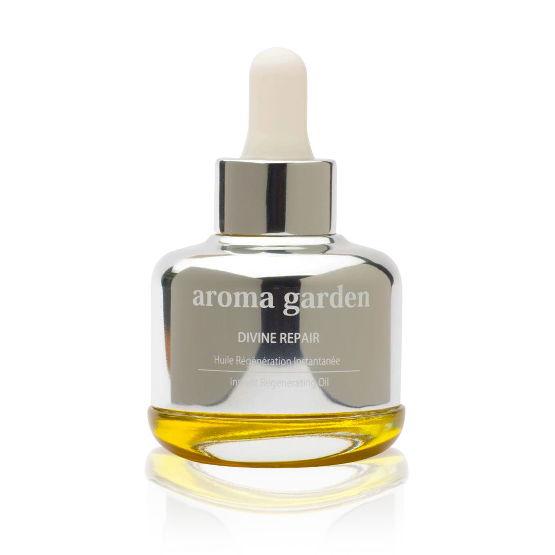 Flakon mit silberfarbenem Verschluss und Pipette. Aufschrift: aroma garden, Divine Repair. Gelbliche Flüssigkeit sichtbar.
