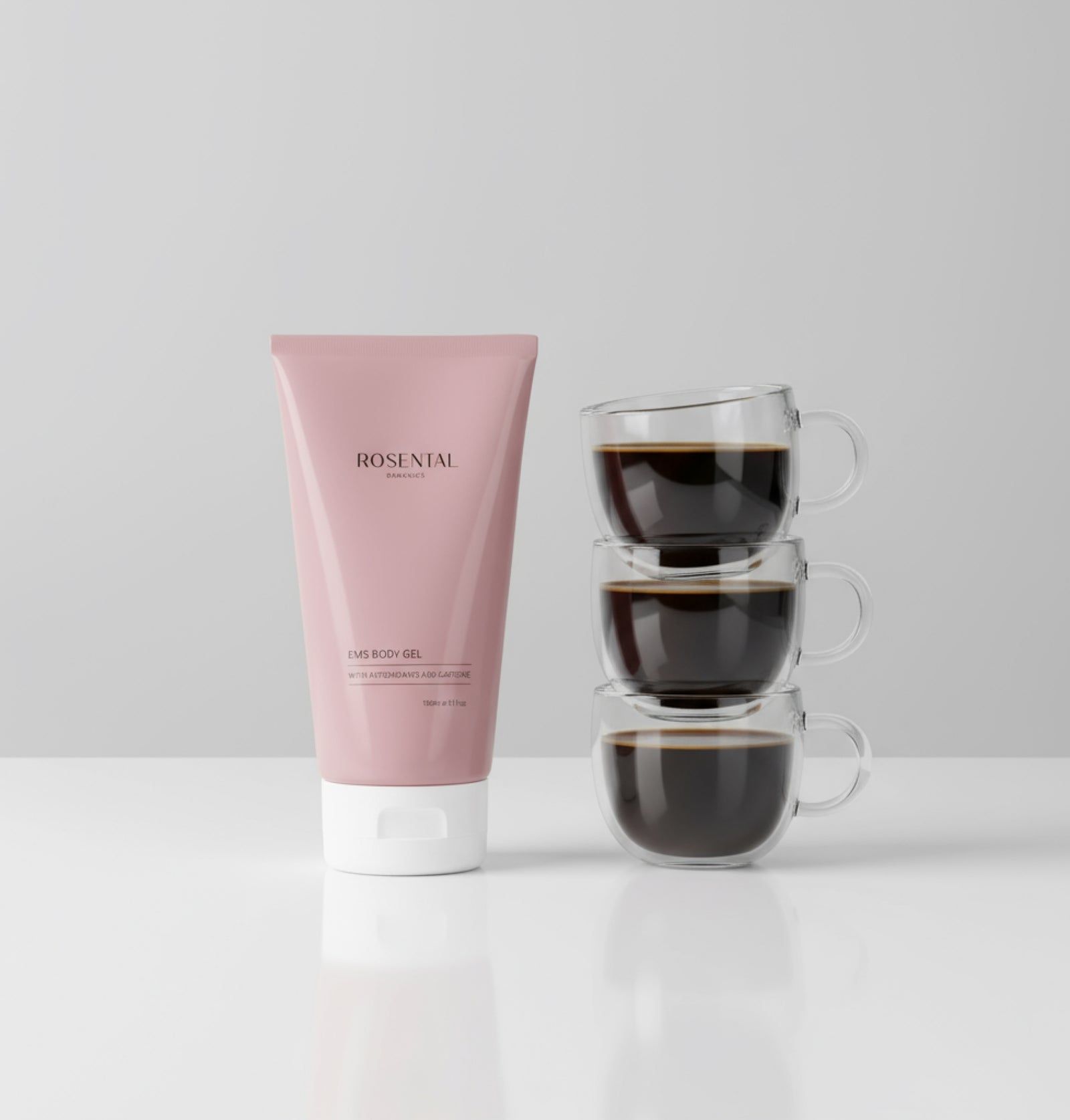 Rosa Tube neben drei Kaffeetassen. Aufschrift: Rosental Organics, EMS Body Gel.
