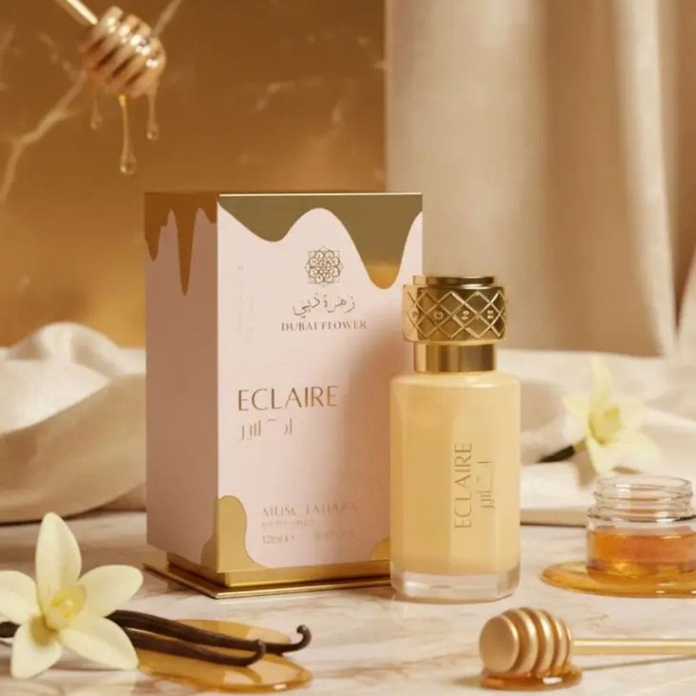 Parfümflakon und Verpackung. Goldfarbener Deckel, Schriftzug ECLAIR. Beige Flasche und Box mit goldfarbenen Akzenten.