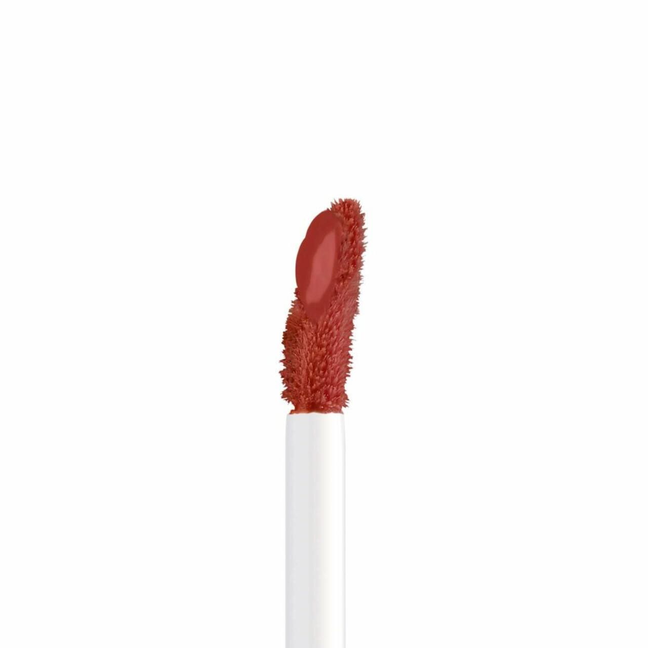 Applikator von Artdeco Mat Passion Lip Fluid. Roter Applikator, Detailansicht. Weißer Stiel.
