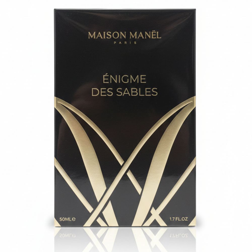 Schwarze rechteckige Schachtel. Goldfarbener Schriftzug: Maison Manel Paris, Enigme des Sables. Unten: 50ml, 1.7 FL.OZ.