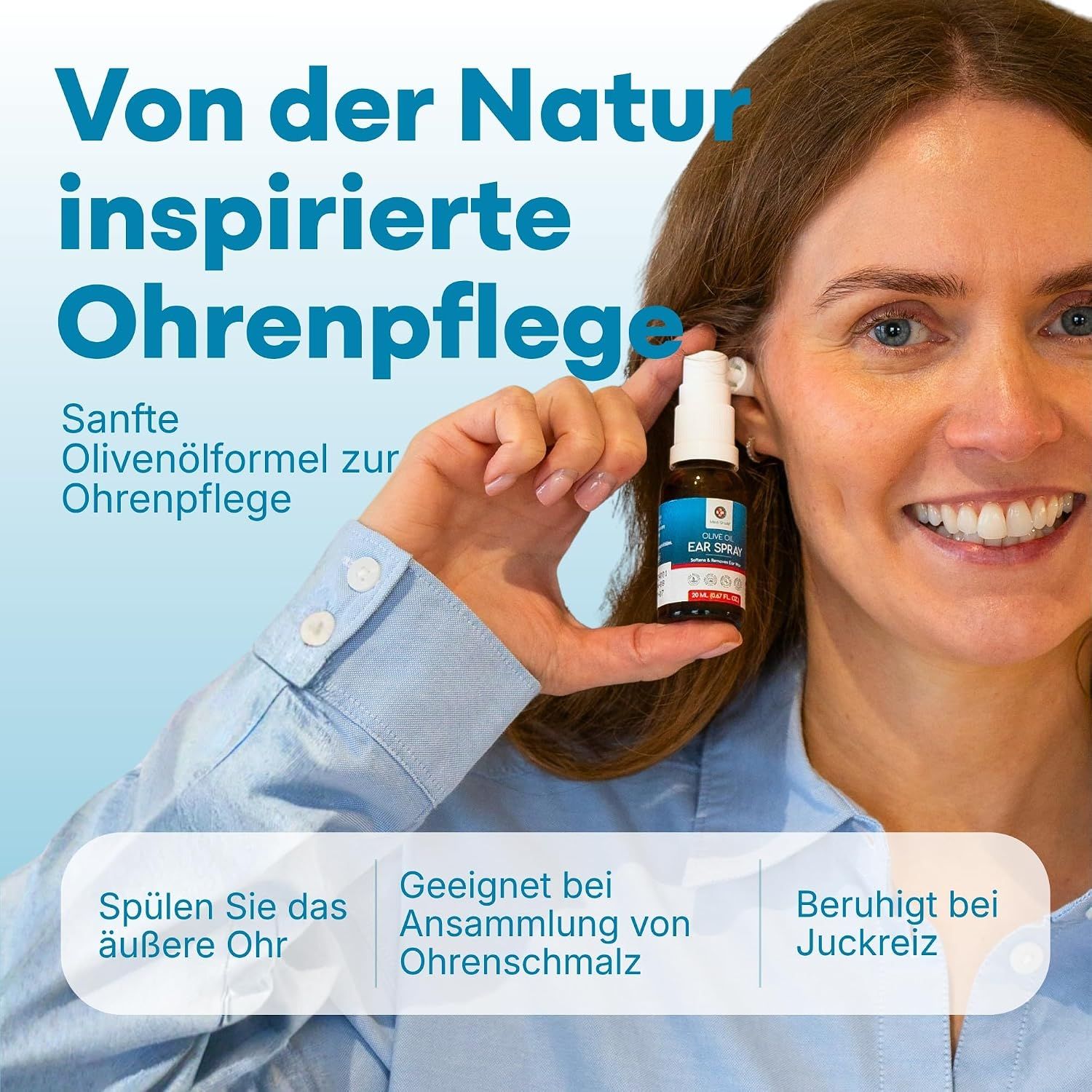 Frau hält eine kleine Sprühflasche mit Olivenöl-Ohrspray.