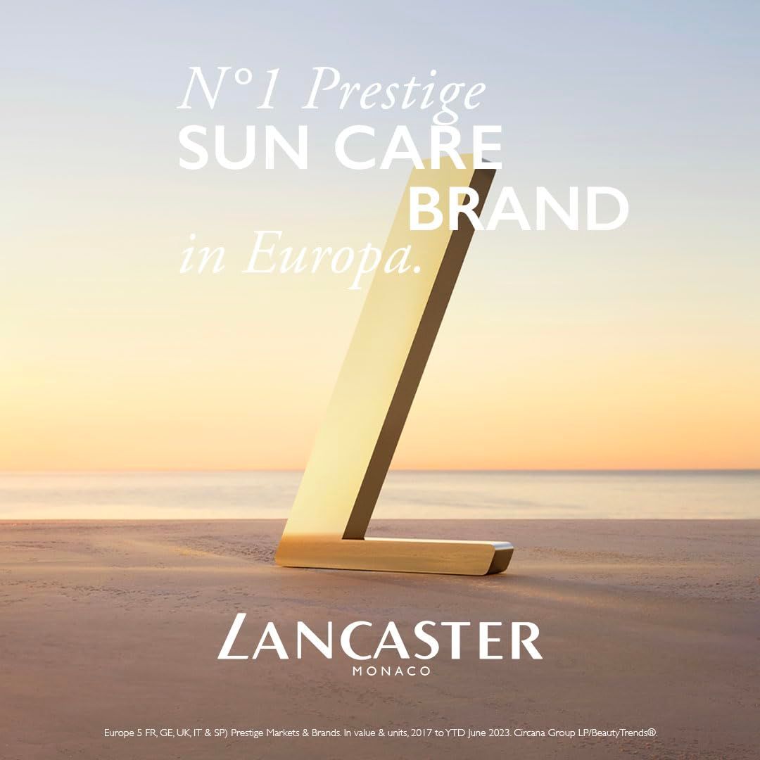 Goldenes 'L' auf Strandhintergrund. Text: N°1 Prestige SUN CARE BRAND in Europa. Marke: Lancaster Monaco.