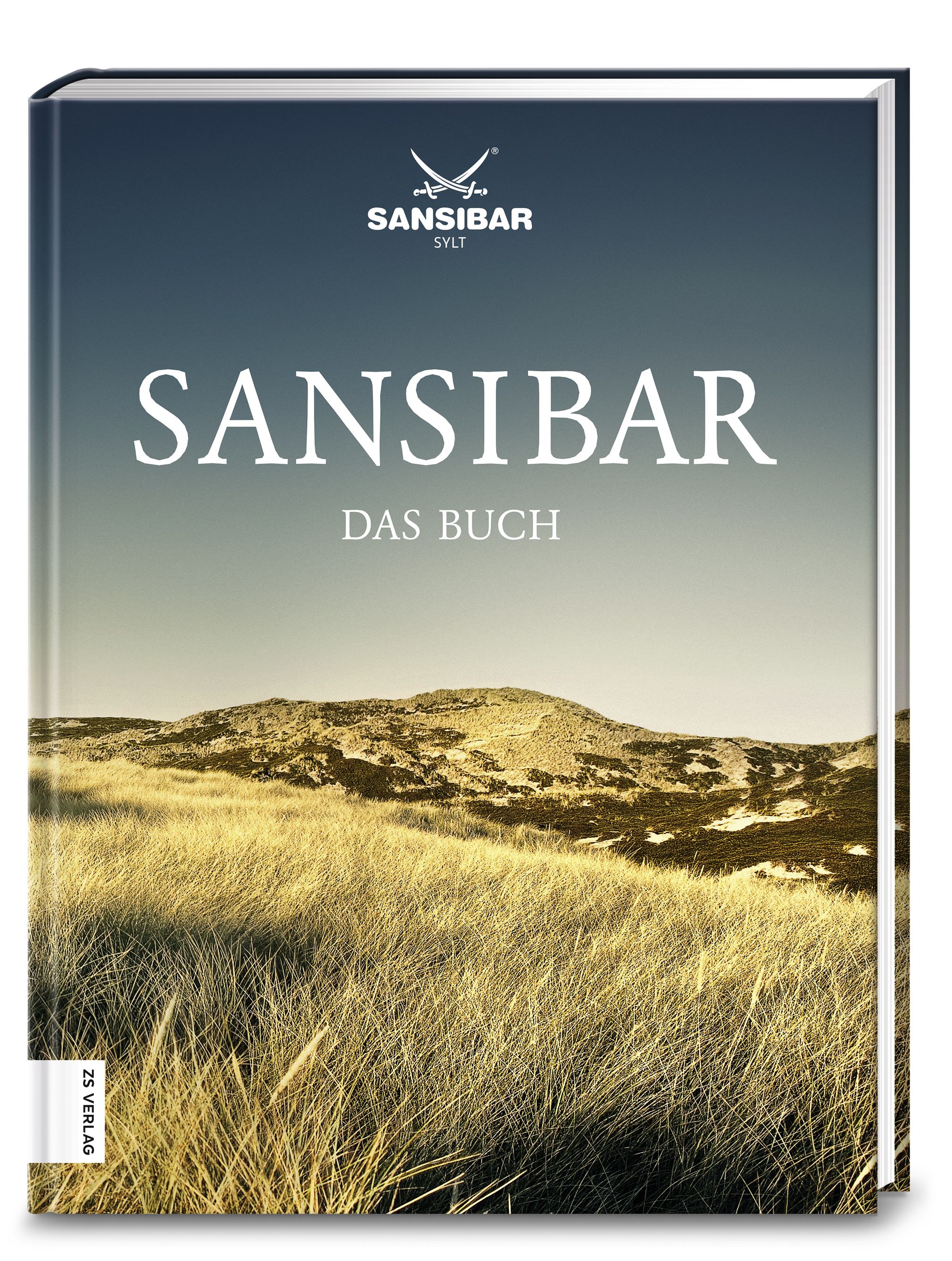 Buch mit dem Titel "Sansibar Das Buch". Auf dem Cover ist eine Landschaft mit Dünen und Gras zu sehen. Das Logo "Sansibar Sylt" ist oben.