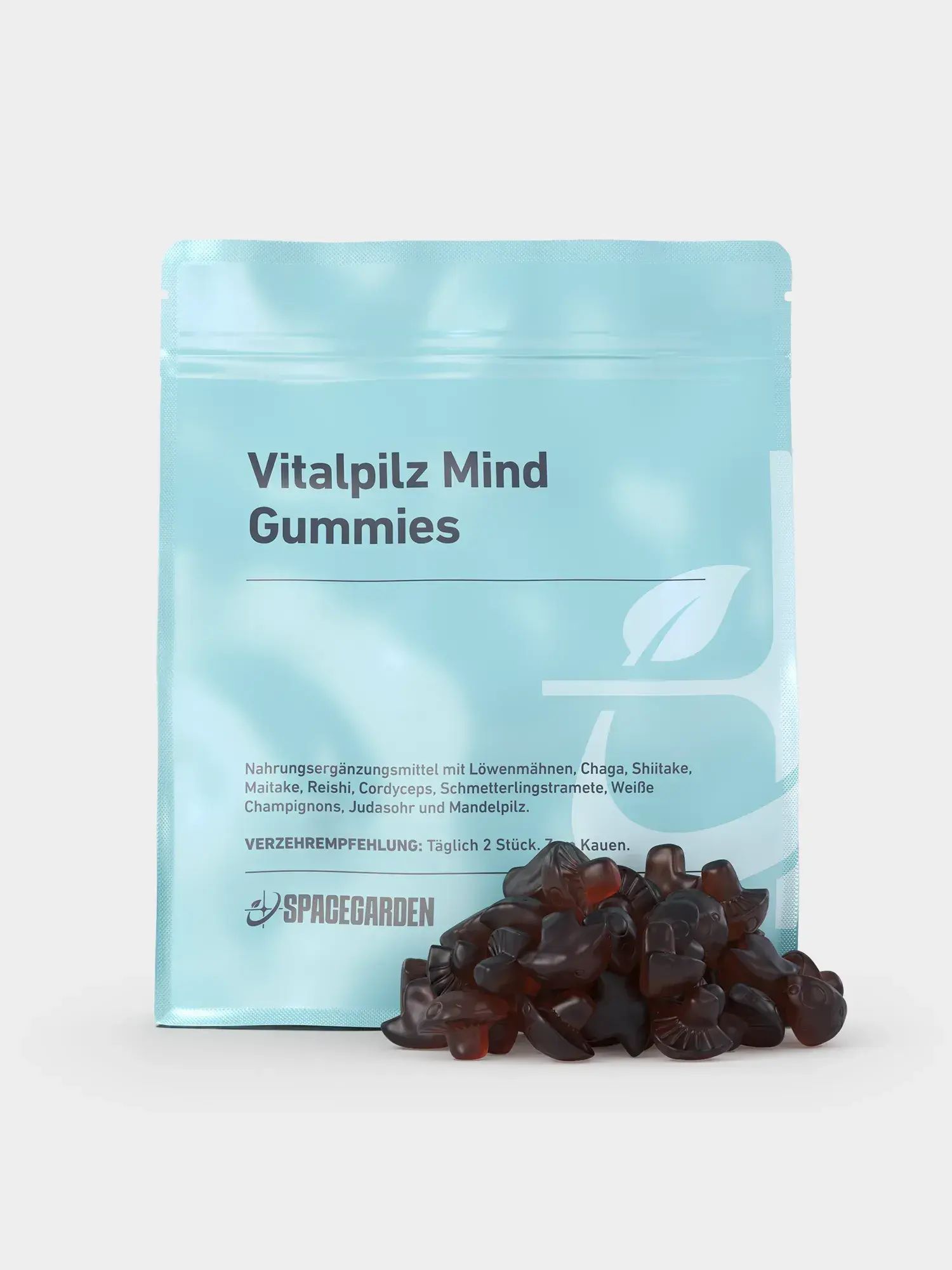 Hellblaues Beutel mit Vitalpilz Mind Gummies. Aufschrift: Spacegarden. Geleefrüchte liegen davor. Verzehrempfehlung: Täglich 2 Stück kauen.