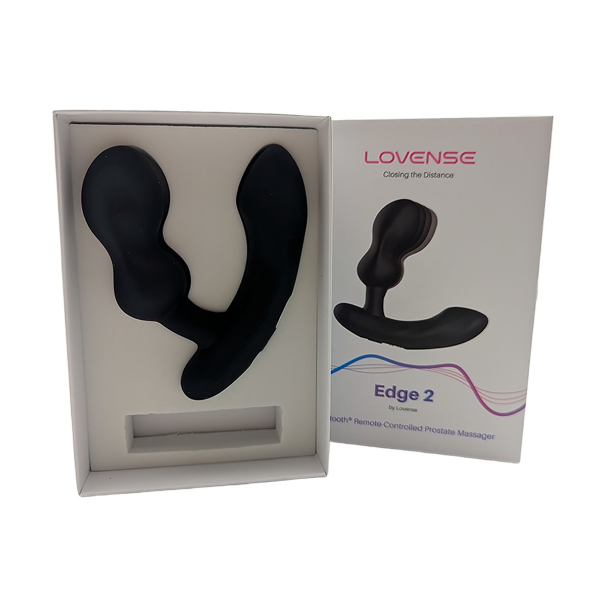 Schwarzer Prostata-Massager in einer geöffneten weißen Produktbox, daneben die Verpackung.
