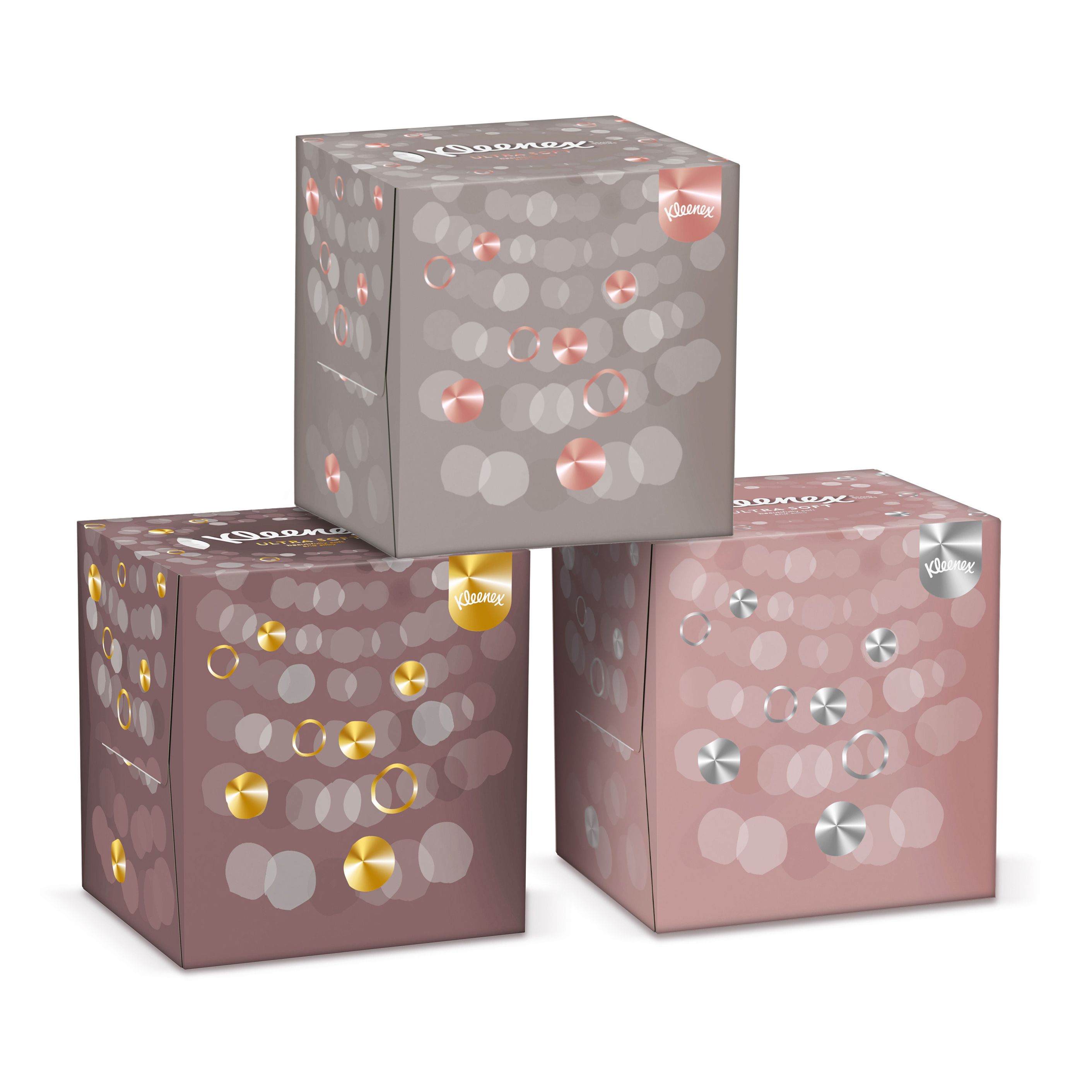 Drei Kleenex Ultra Soft Kosmetiktücher-Boxen. Gestapelt. Verschiedene Farben. Mit Logo und Dekoration.