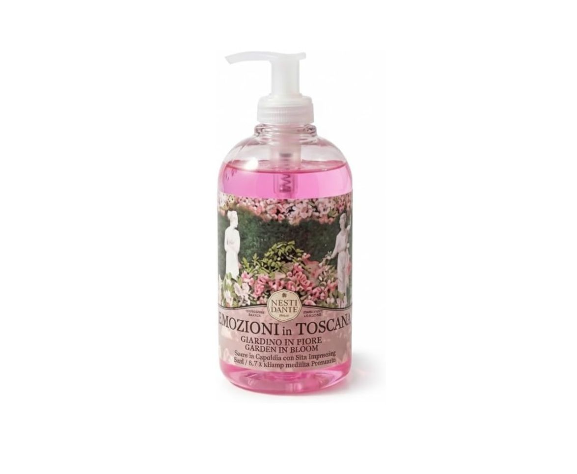 Transparente Flasche mit rosa Flüssigseife und Dosierpumpe. Etikett mit floralem Design und Text.