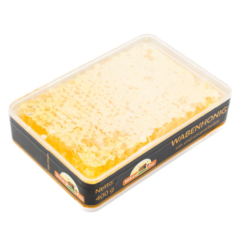 Honigwabe Set in transparenter Verpackung. Aufschrift: Wabenhonig, roh und unverarbeitet. Marke: ImkerPur. Nettogewicht: 400 g.