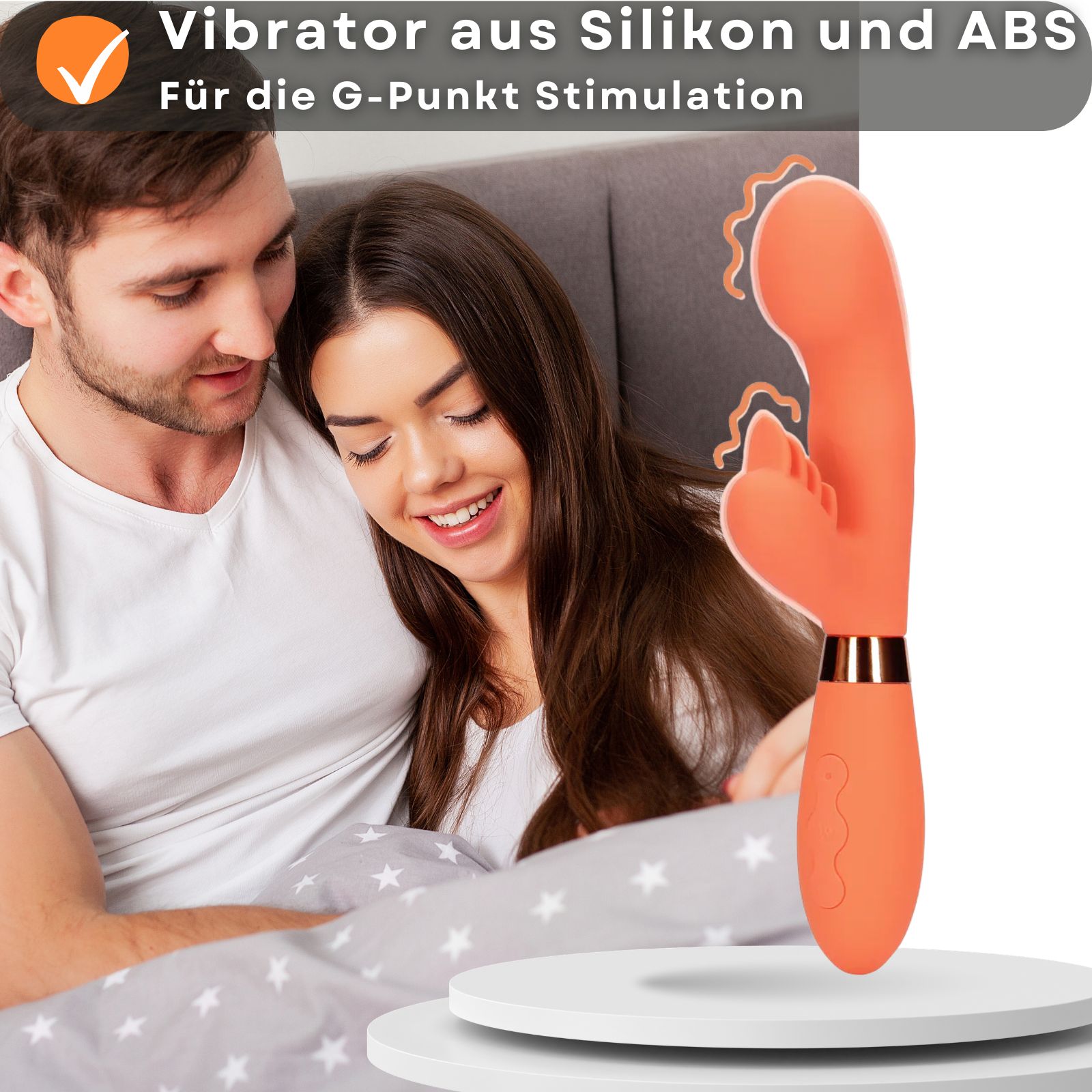 Orangener Vibrator. Silikon, ergonomische Form. G-Punkt-Stimulation. Paar im Hintergrund.