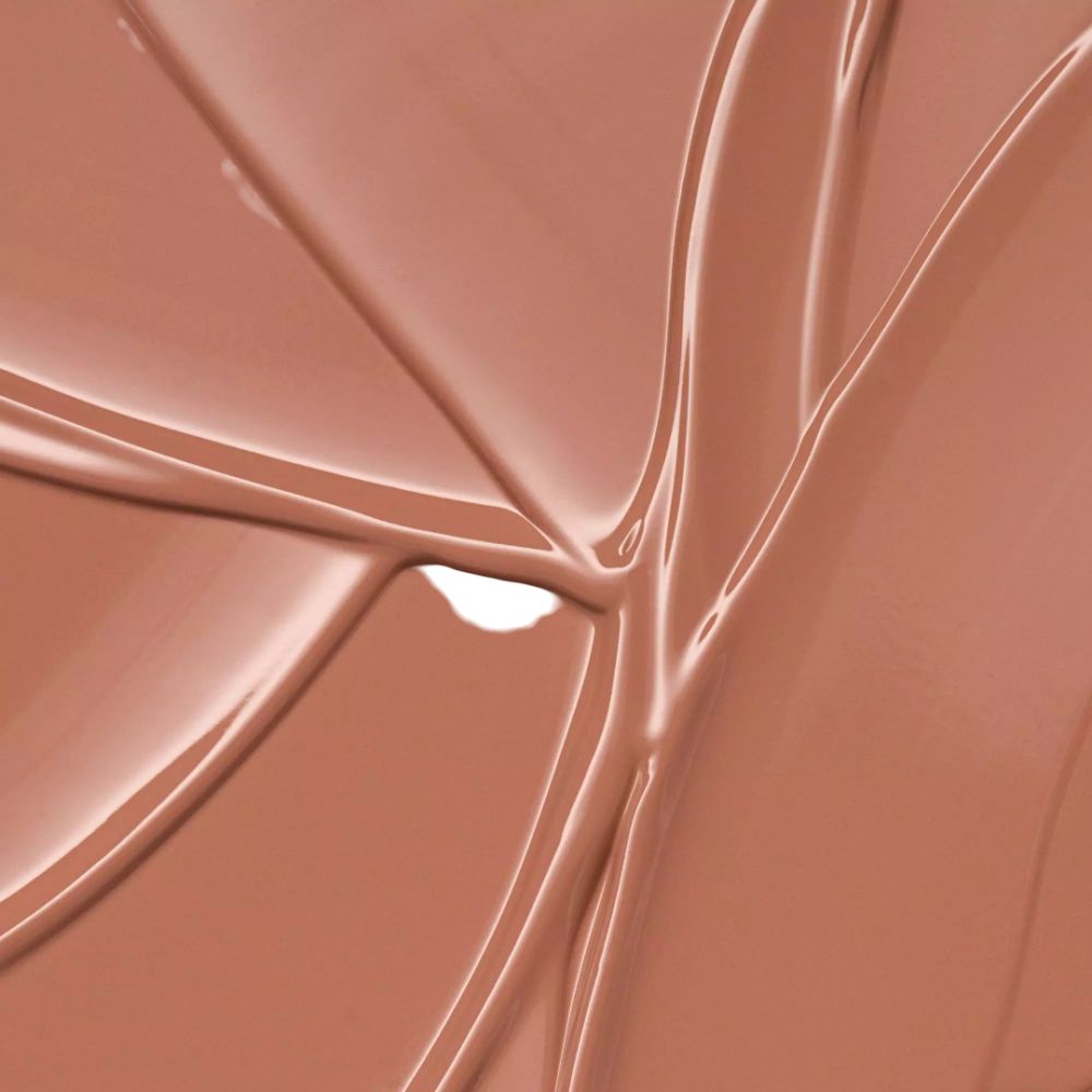 Nahaufnahme von Nude-Lippenstift-Farbe. Glänzende Textur.