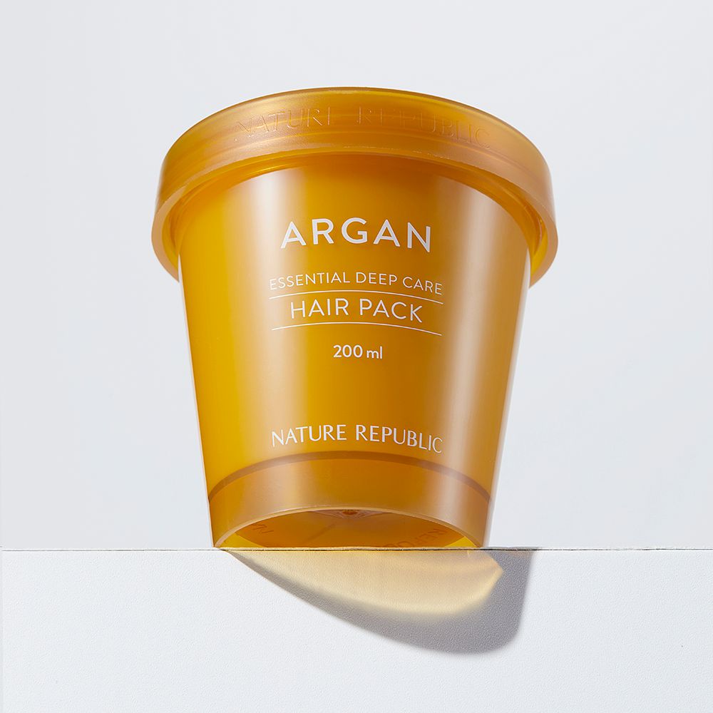 Behälter mit Aufschrift ARGAN, ESSENTIAL DEEP CARE HAIR PACK, 200 ml. Marke NATURE REPUBLIC. Braune Farbe.