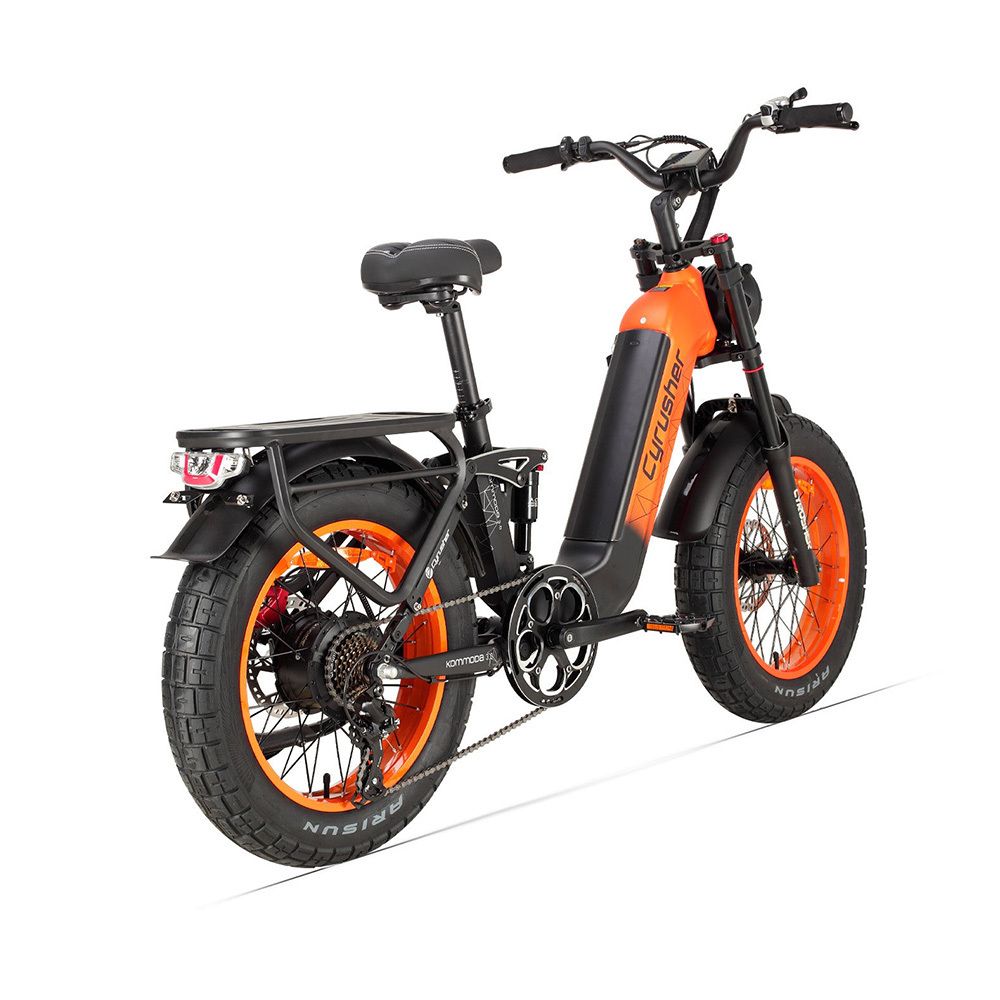 E-Bike Cyrusher, orange und schwarz. Breitreifen, Gepäckträger, Rücklicht.
