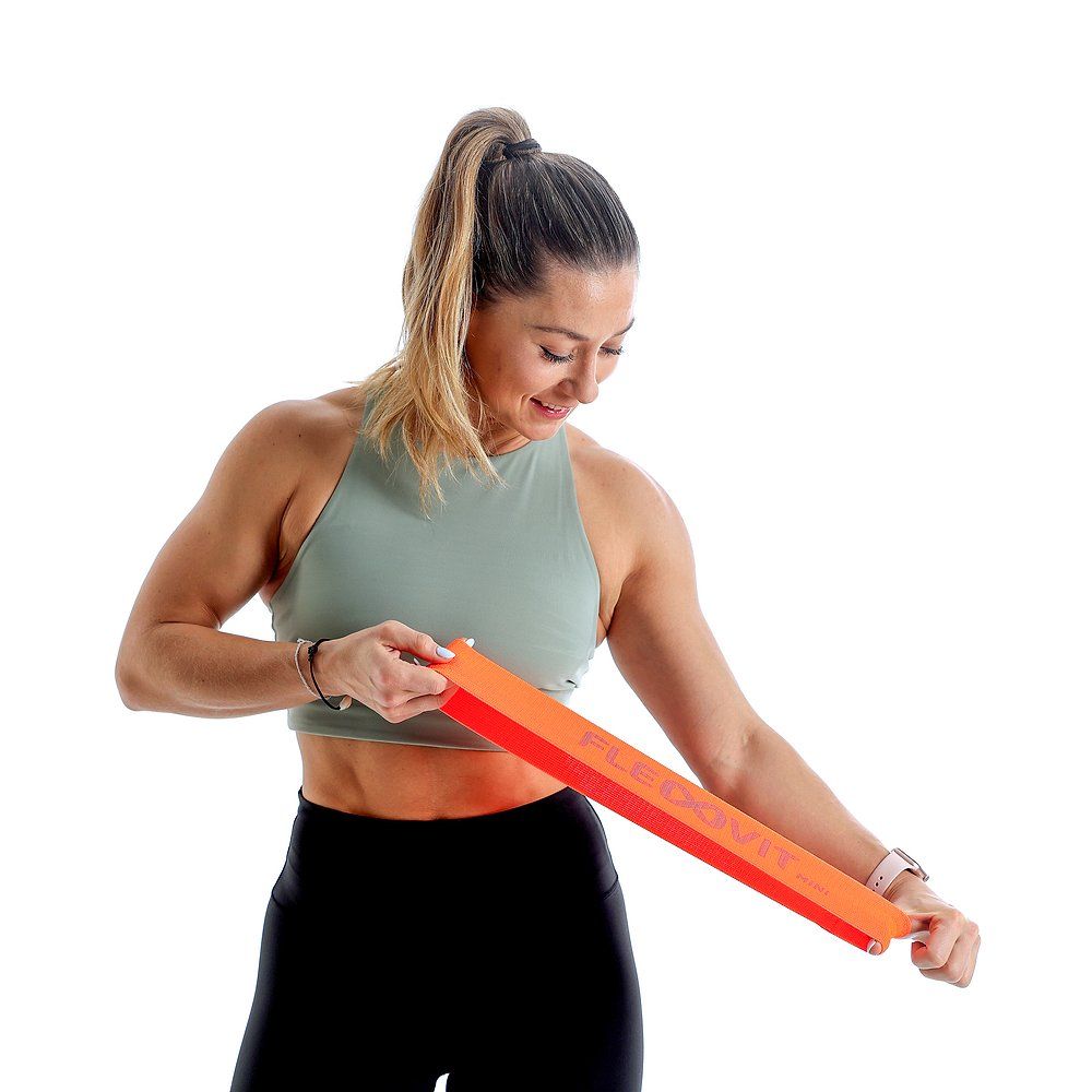 Schwarzes FLEXVIT Mini-Band mit grauem Schriftzug FLEXVIT mini. Das Band liegt auf weißem Hintergrund.