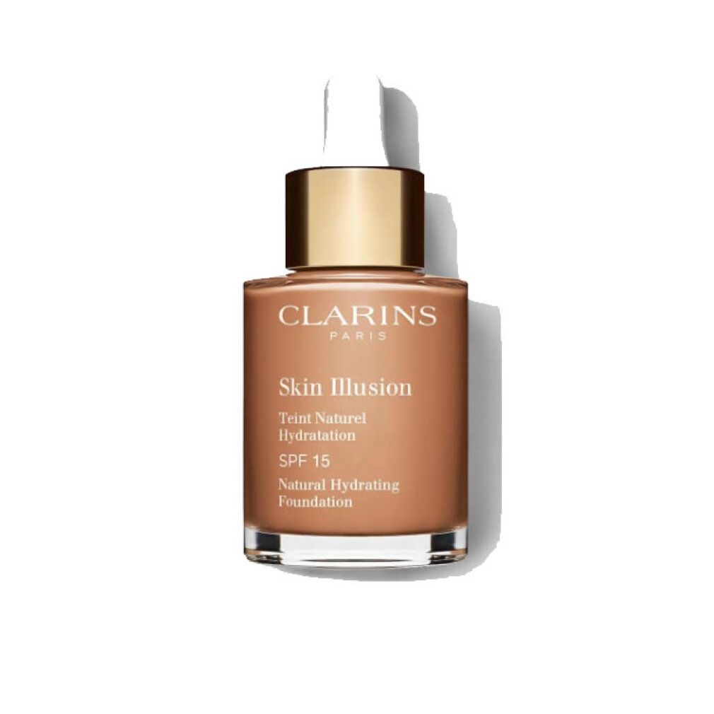 Clarins Skin Illusion Foundation. Braune Flüssigkeit in Glasflasche mit goldener Kappe und Pipette. SPF 15.